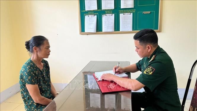 Đối tượng Trần Thị Gái tại cơ quan điều tra. Ảnh: TTXVN