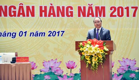 Thủ tướng đ&aacute;nh gi&aacute; cao phản ứng ch&iacute;nh s&aacute;ch của NHNN trong năm 2016. (Ảnh: VGP/Nhật Bắc)