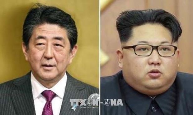 Thủ tướng Nhật Bản Shinzo Abe (tr&aacute;i) v&agrave; Nh&agrave; l&atilde;nh đạo Triều Ti&ecirc;n Kim Jong-un. Ảnh: Kyodo