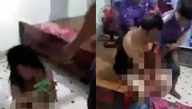 H&igrave;nh ảnh cắt từ clip vụ đ&aacute;nh ghen được tung l&ecirc;n mạng khiến dư luận phẫn nộ.