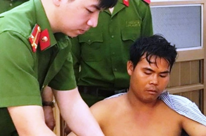 Nghi phạm Qu&agrave;ng Văn Thanh đang được điều trị dưới sự gi&aacute;m s&aacute;t của cơ quan c&ocirc;ng an.