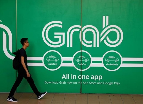 B&ecirc;n ngo&agrave;i văn ph&ograve;ng của Grab tại Singapore. Ảnh: ReutesB&ecirc;n ngo&agrave;i văn ph&ograve;ng của Grab tại Singapore. Ảnh: Reutes