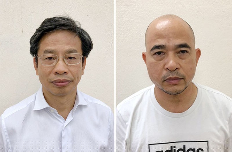 Bị can Nguyễn Xuân Sơn ( người mặc áo sơ mi trắng, đeo kính) và bị can Vũ Trọng Hải. 