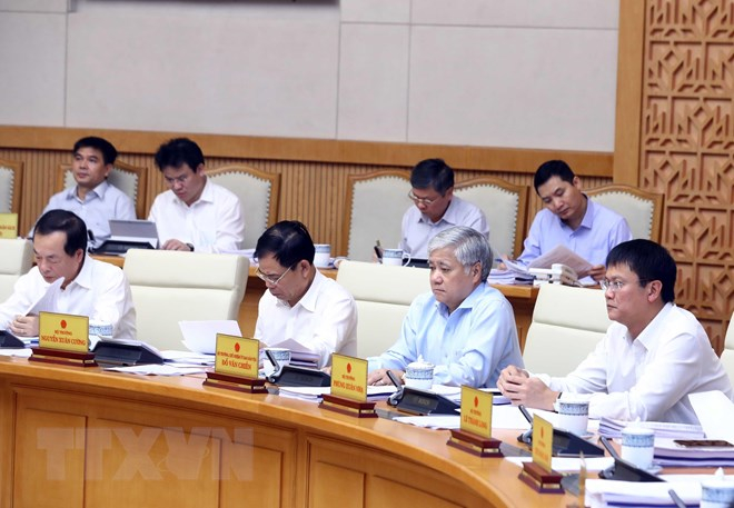 Các thành viên Chính phủ và đại biểu tham dự phiên họp. (Ảnh: Thống Nhất/TTXVN)