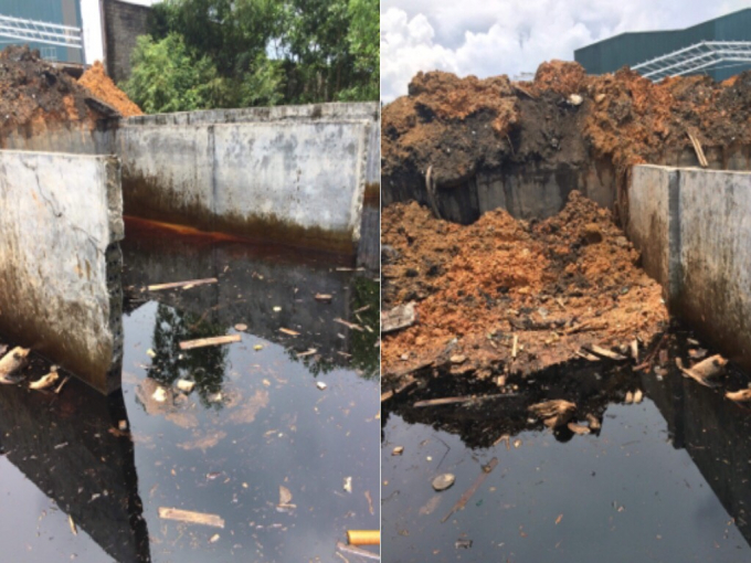 Nước thải lắng đọng đang được c&ocirc;ng ty xử l&yacute; bằng c&aacute;ch lấp đất l&ecirc;n bề mặt nước thải.
