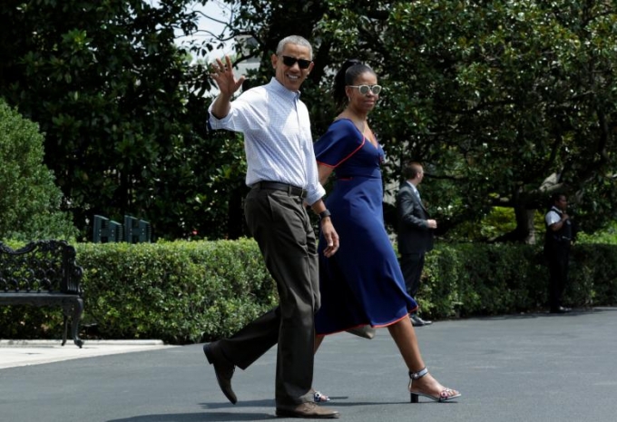 Tổng thống Obama v&agrave; Đệ nhất phu nh&acirc;n trong 1 chuyến c&ocirc;ng du nước ngo&agrave;i. (Ảnh: Reuters)