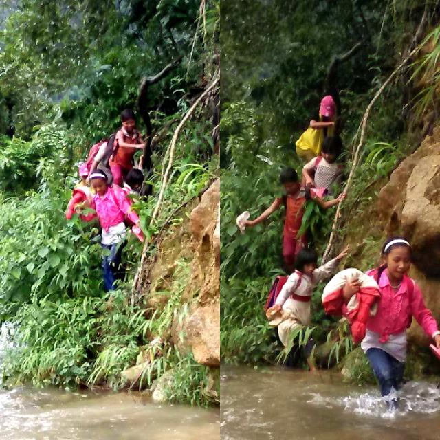 Thầy c&ocirc; v&agrave; học sinh đi qua khe n&uacute;i trước khi vượt suối.