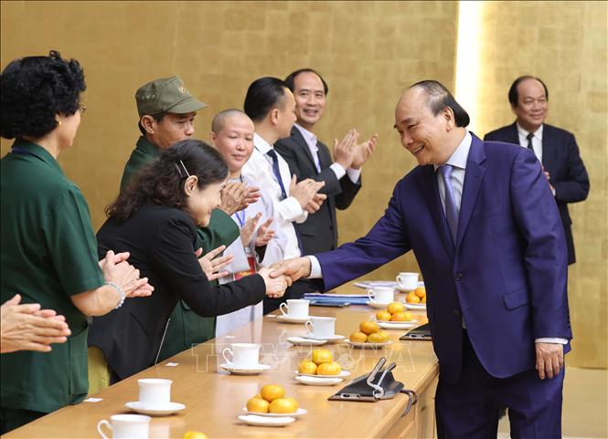 Thủ tướng Nguyễn Xuân Phúc với các đại biểu tại buổi gặp mặt. Ảnh: Thống Nhất/TTXVN