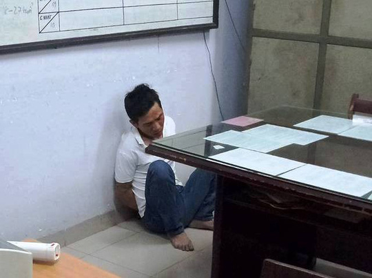 Nghi can L&ecirc; Th&agrave;nh T&acirc;m tại cơ quan điều tra ( Ảnh: NLĐO)