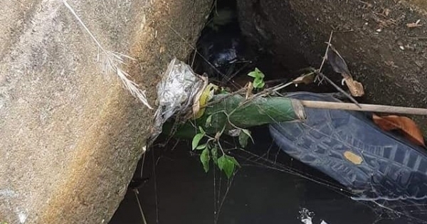 Danh tính thi thể kẹt chặt trong cống nước chỉ lộ phần chân ra ngoài